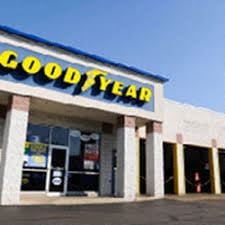 Woodbury apartment for rent - The front of a Good Year store with a blue and yellow sign.