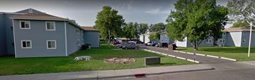Billings apartment for rent - an image of a neighborhood with houses and cars parked in the grass