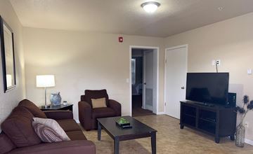 Watford City apartment for rent - a living room with a couch and a tv