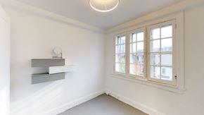 Ottawa apartment for rent - a living room with a large window and white walls