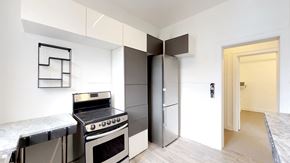 Ottawa apartment for rent - a kitchen with a stove and a refrigerator