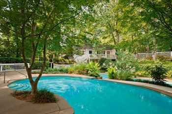 Resort-style terraced pool with a waterfall