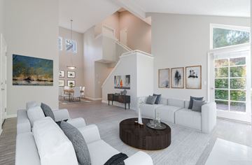 Riverside apartment for rent - A living room with a white couch and a coffee table.