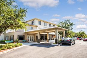 Fort Myers apartment for rent - covered drive up entrance to Villa Vincente Senior Apartments in Fort Myers, FL