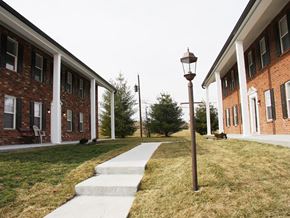 Saint Charles apartment for rent - a sidewalk in front of a brick building