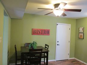 Saint Charles apartment for rent - a dining room with a table and a ceiling fan