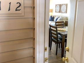 O'fallon apartment for rent - a view through a door into a dining room with a table and chairs