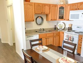 O'fallon apartment for rent - a kitchen and dining area with a table and chairs