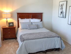 Saints Charles townhouse for rent - a bedroom with a bed and two night stands