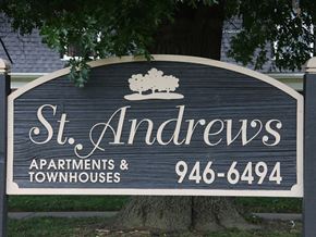 St. Charles townhouse for rent - a sign apartments and townhouses in front of a tree