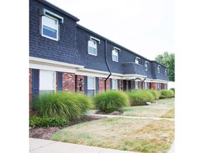 St. Charles townhouse for rent - a row of houses with blue roofs and a sidewalk