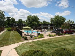 St. Charles townhouse for rent - a swimming pool in a yard with a fence
