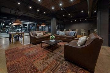 St. Louis apartment for rent - a living room with couches and a table