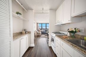 St. Louis apartment for rent - a kitchen with white cabinets and counter tops