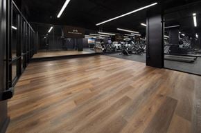 St. Louis apartment for rent - a fitness center with hardwood floors and a gym