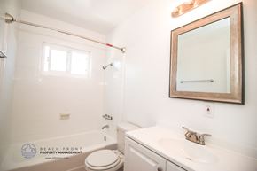 Torrance apartment for rent - a bathroom with a sink toilet and a mirror and a tub