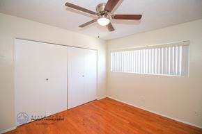 Torrance apartment for rent - a bedroom with a ceiling fan and a closet