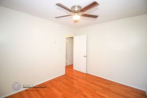 Torrance apartment for rent - a bedroom with wood floors and a ceiling fan