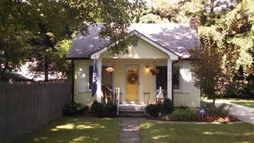 Southfield house for rent - A house with a flag on the front porch.