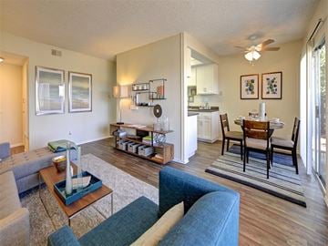 El Cajon apartment for rent - A living room with a blue couch and a coffee table.