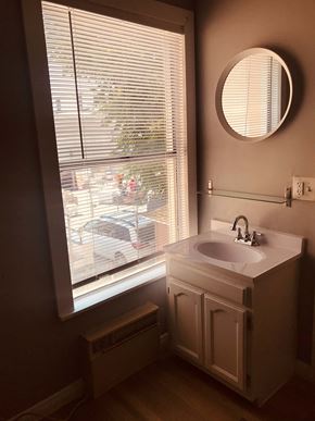Los Angeles apartment for rent - a bathroom with a window and a sink and a mirror