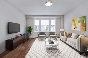 San Francisco apartment for rent - A living room with a couch, chairs, and a television.