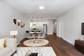 San Francisco apartment for rent - A modern living room with a dining area in the background.