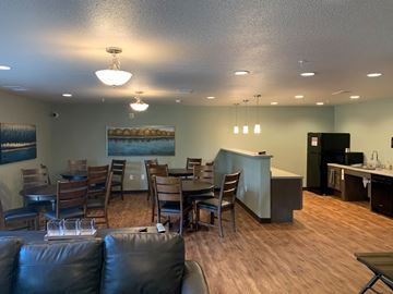 Willmar apartment for rent - a dining room with a table and chairs and a kitchen