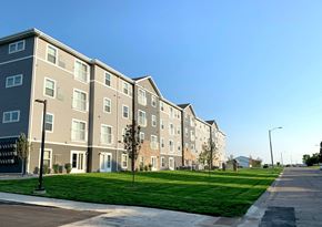 Willmar apartment for rent - a row of apartment buildings on the side of a street