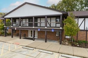 Canton apartment for rent - the front of a building with a porch and a parking lot