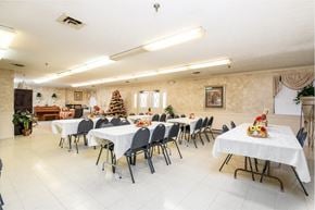 Canton apartment for rent - a dining room with tables and chairs and a christmas tree