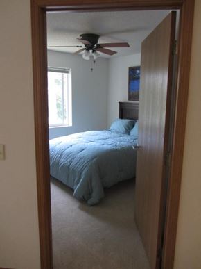 Hudson apartment for rent - a bedroom with a bed and a ceiling fan