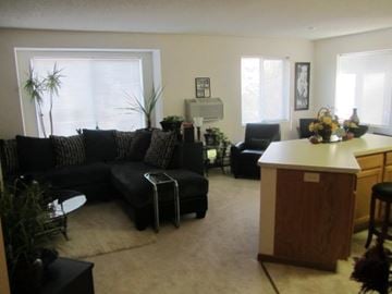 Hudson apartment for rent - a living room with a couch and a table