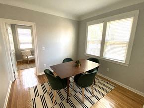 Detroit apartment for rent - a dining room with a table and chairs