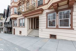 San Francisco apartment for rent - A building with a balcony and a door.