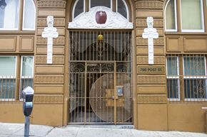 San Francisco apartment for rent - A building with a large gate and a cross on it.