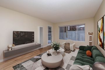 Oakland apartment for rent - A living room with a television, a couch, and a coffee table.