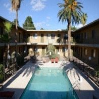 Tucson apartment for rent - the pool is surrounded by palm trees at the inn of the governors