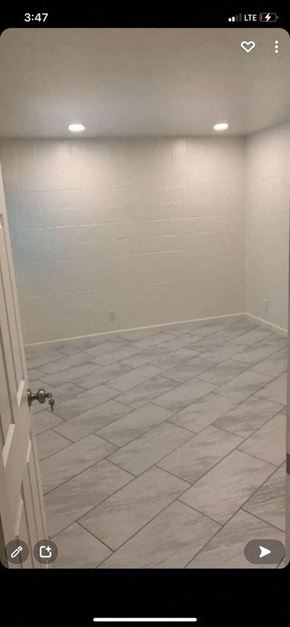 Tucson apartment for rent - a bathroom with a tiled floor and a white wall