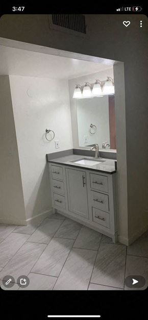 Tucson apartment for rent - a bathroom with a sink and a mirror