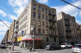 The Bronx apartment for rent - a tall building on the corner of a city street
