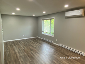 Brandon apartment for rent - the living room of a new home with wooden floors and a window