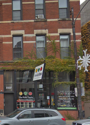 Chicago apartment for rent - a car parked in front of a brick building