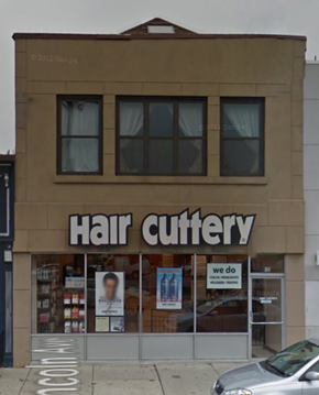 Chicago apartment for rent - a hair cutery store on the side of a building