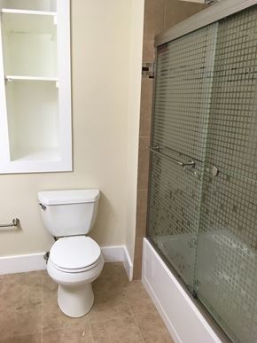 Chicago apartment for rent - a small bathroom with a toilet and a shower