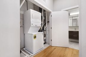 Chicago apartment for rent - a white room with a refrigerator and a washing machine in it