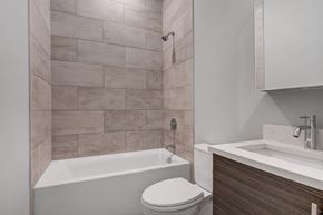 Chicago apartment for rent - a bathroom with a toilet and a tub and a sink