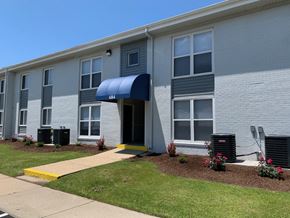 Newport News apartment for rent - a building with an blue awning in front of it