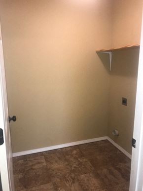 Arkadelphia apartment for rent - A small room with a door and a shelf on the wall.