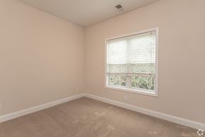 Hickory apartment for rent - A room with a window and beige walls.